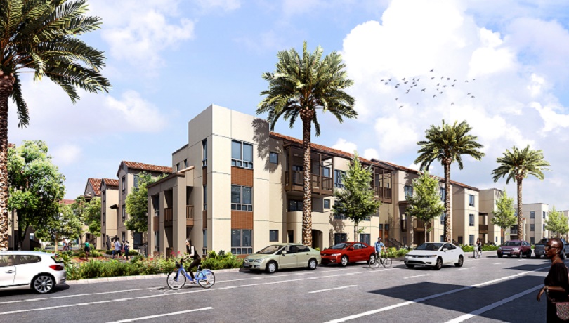 Front angle view of a large light brown three story building. Front sidewalk has palm trees, and a variety of smaller trees surround the building.