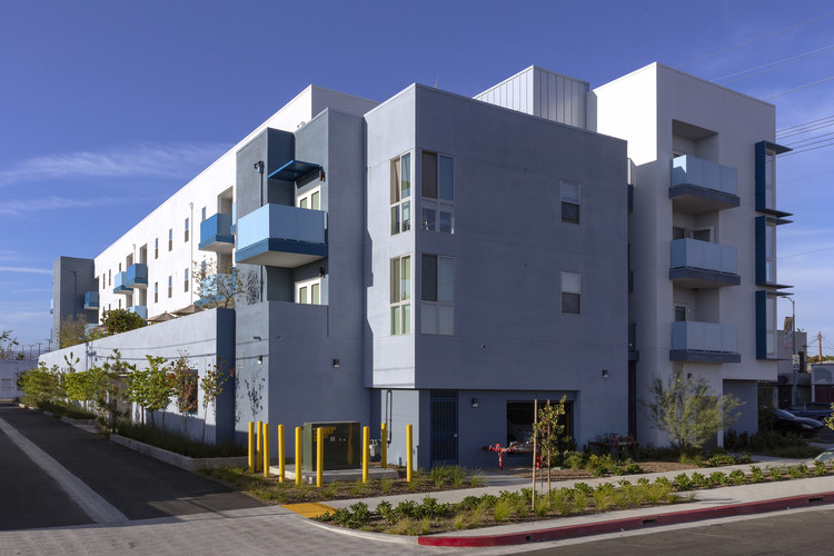 Gray with light blue exterior three story building