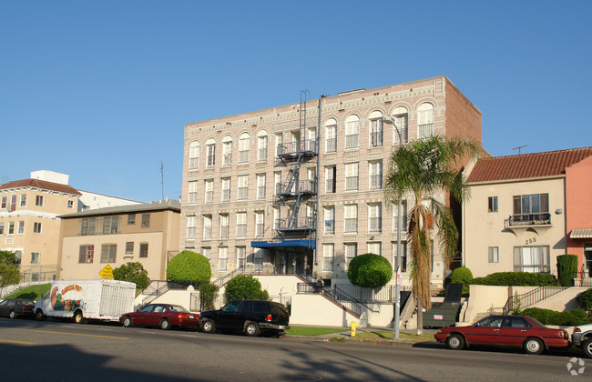 Street view of four story building. Stairwell access to front entrance. Street parking available in front of property