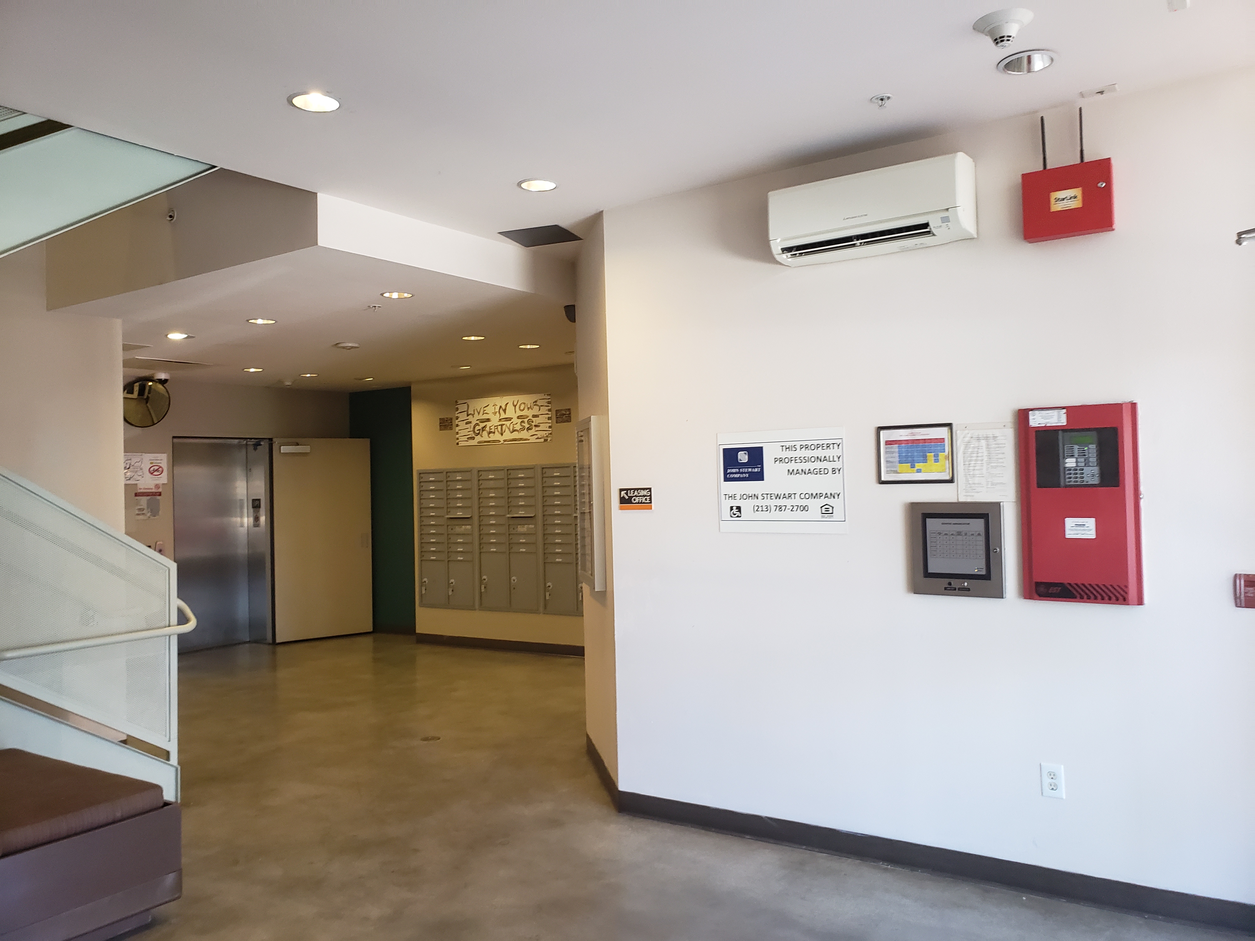 Image of lobby with access to staris and elevator. Mailboxes
along wall near elevator