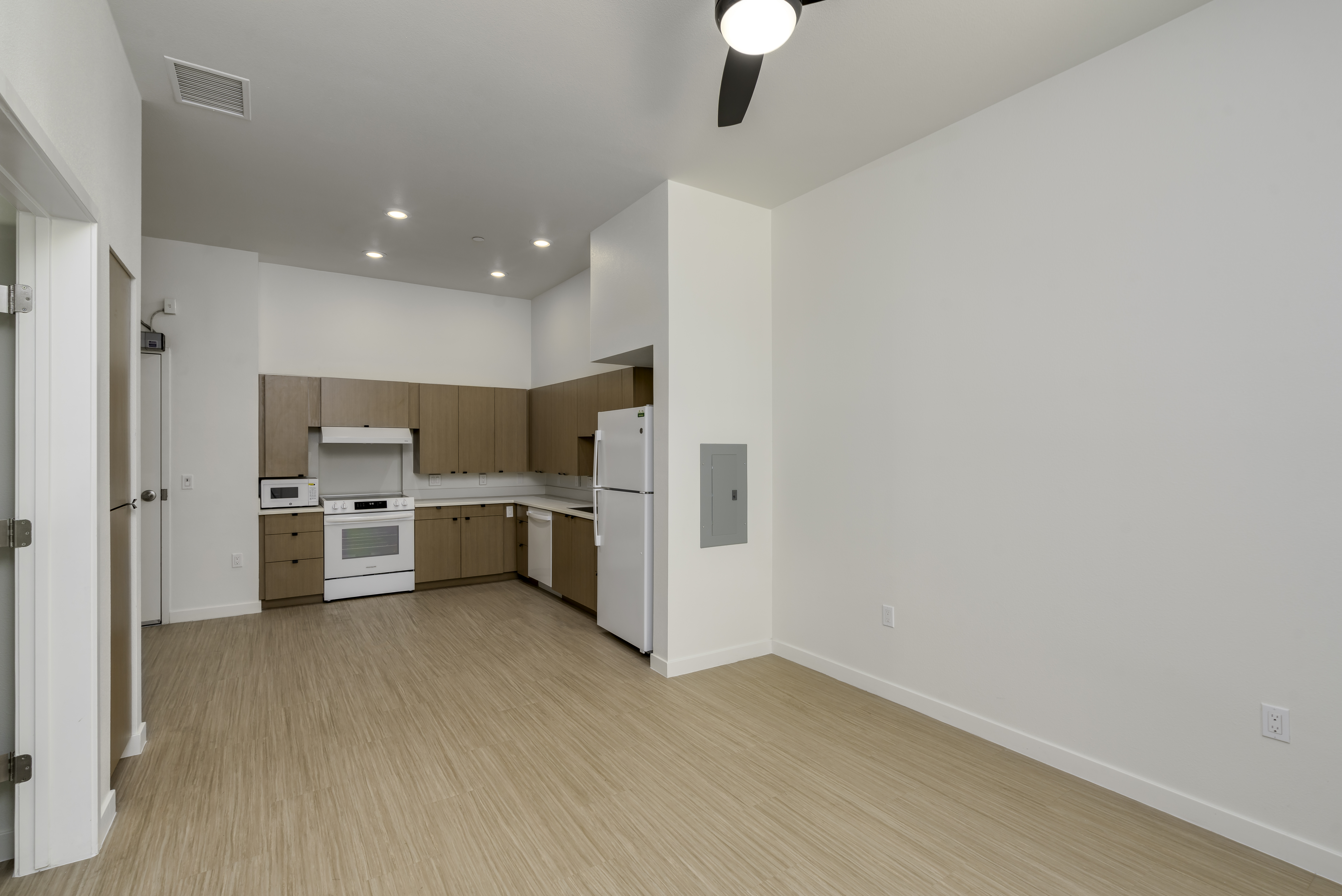 Unit - Living Area. A view of the kitchen and living room.