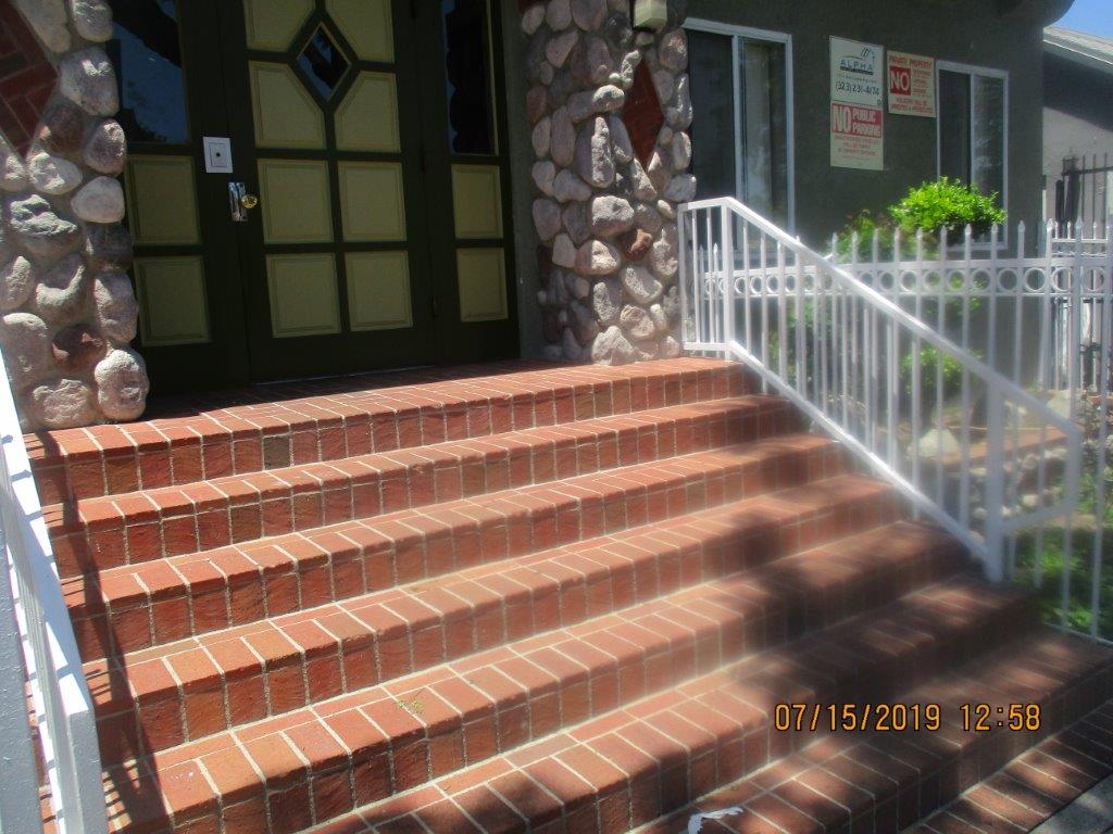 Close up view of steps leading to the decrative front door to the property