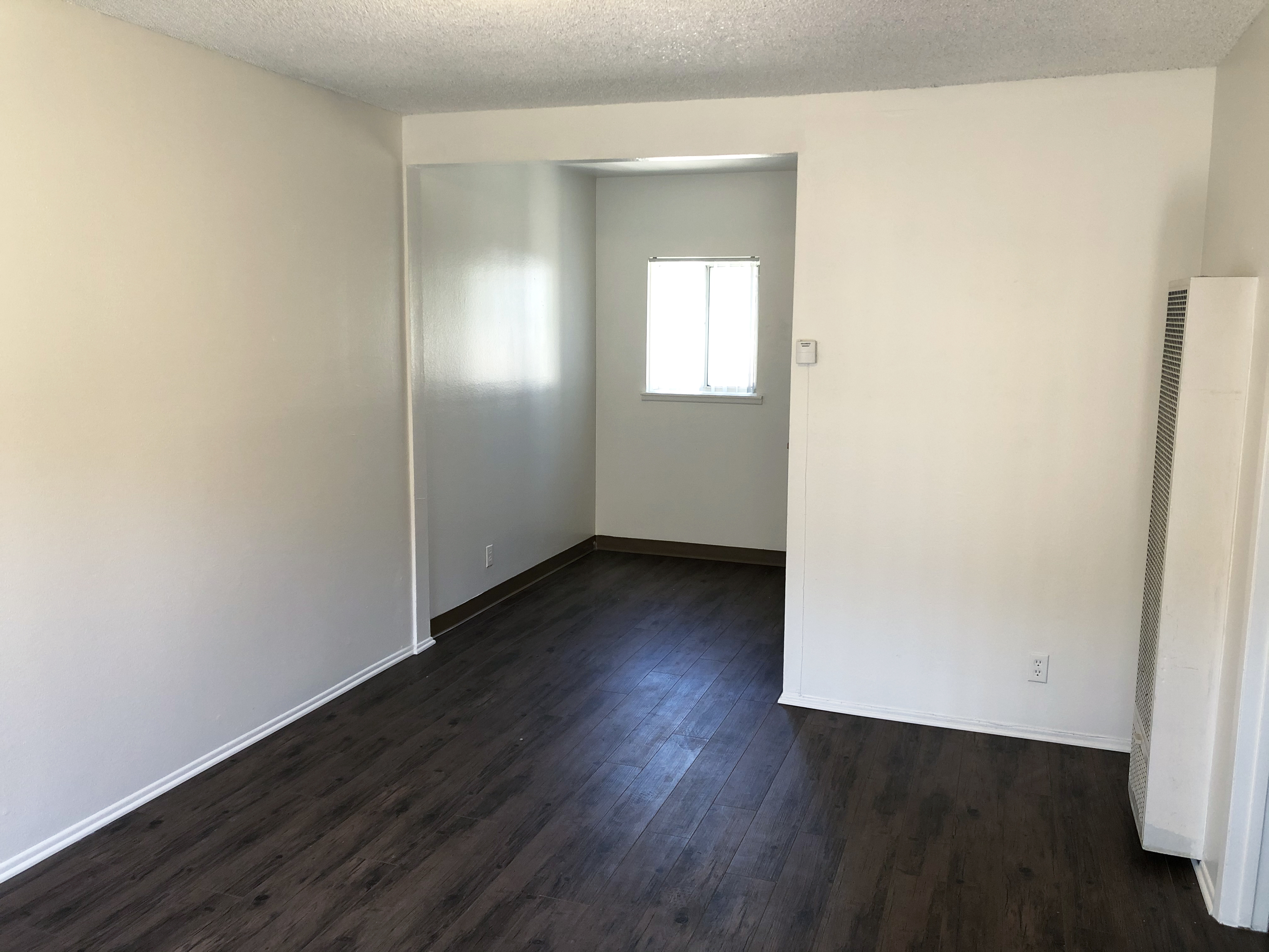 Interior view of an empty room in a unit on the property.