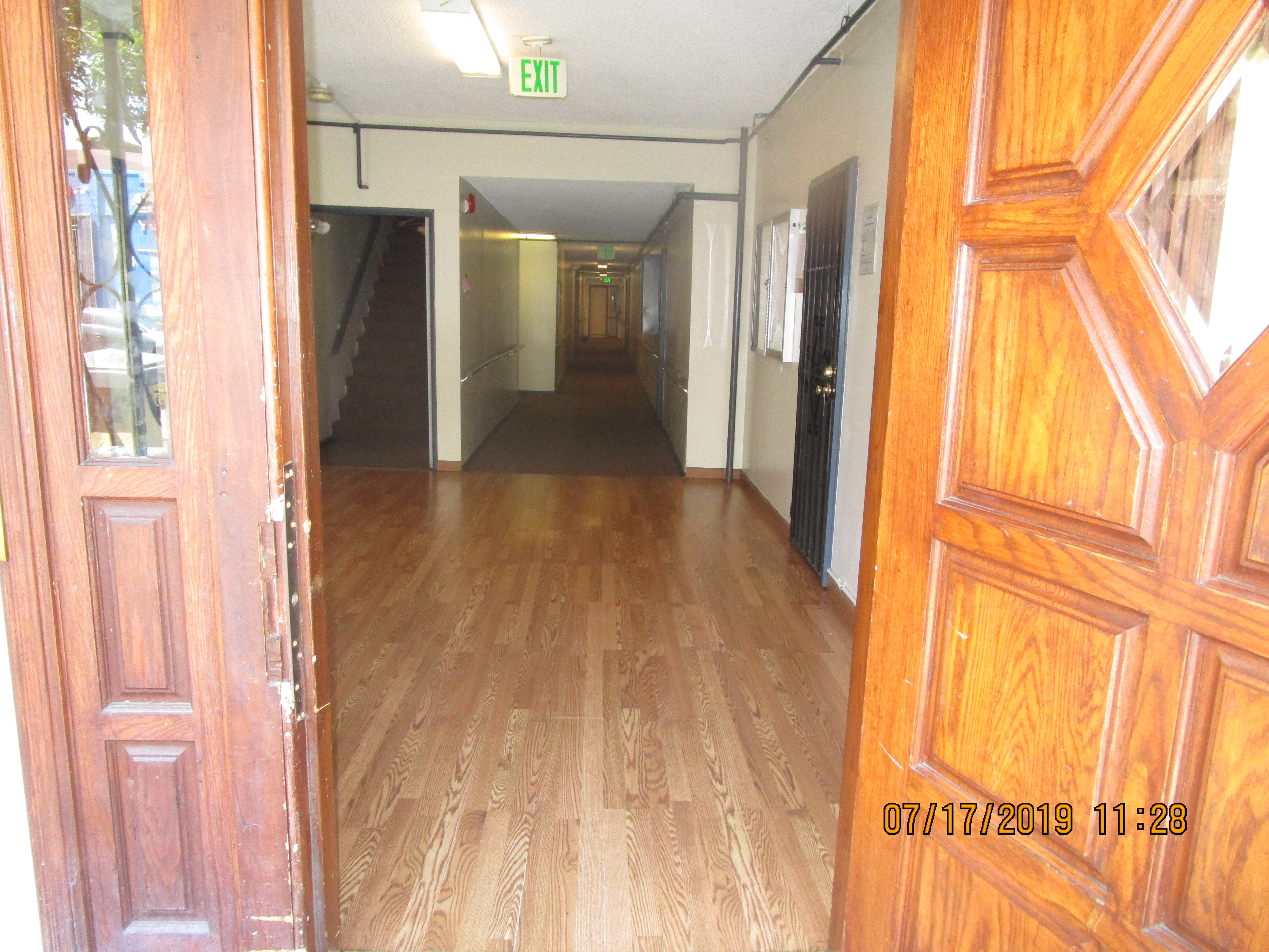 Close up view of the front entrance through the open front door at Leeward A&B Apartments