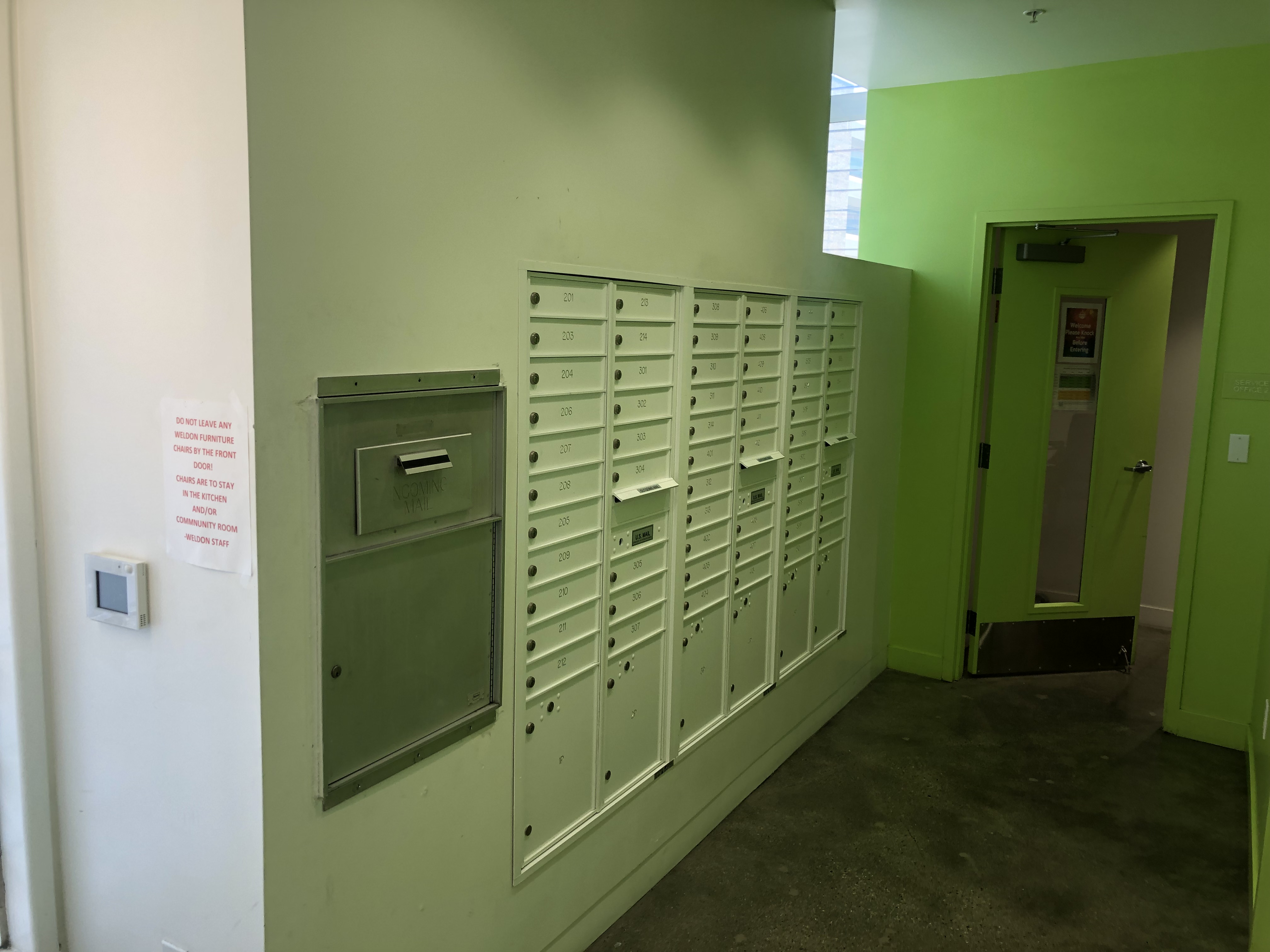 Interior view showing mailboxes along a wall at the Weldon Hotel