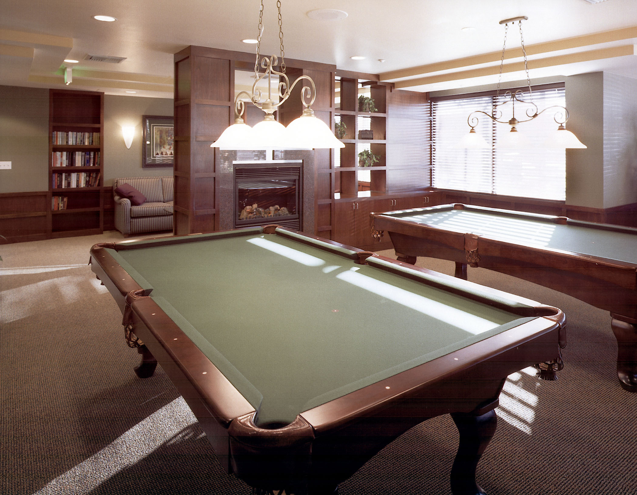 View of the billards room equipped with two pool tables