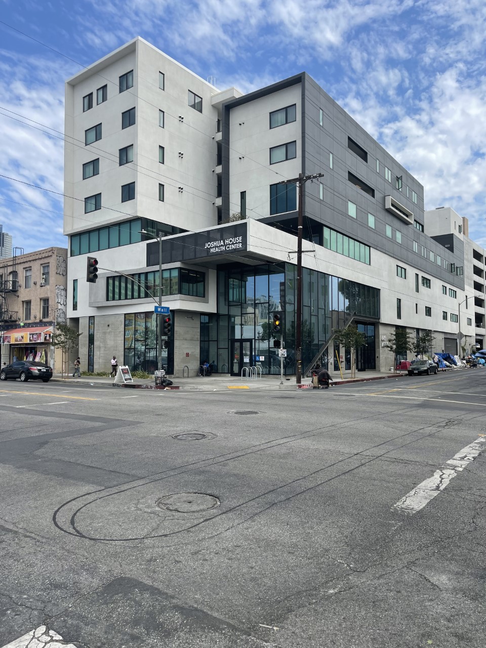 Diagonal view of 649 Lofts Apartments, a black and white building.